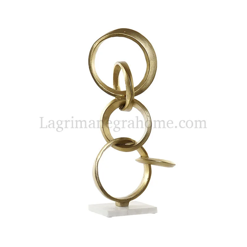 Escultura figura anillos aluminio oro y mármol